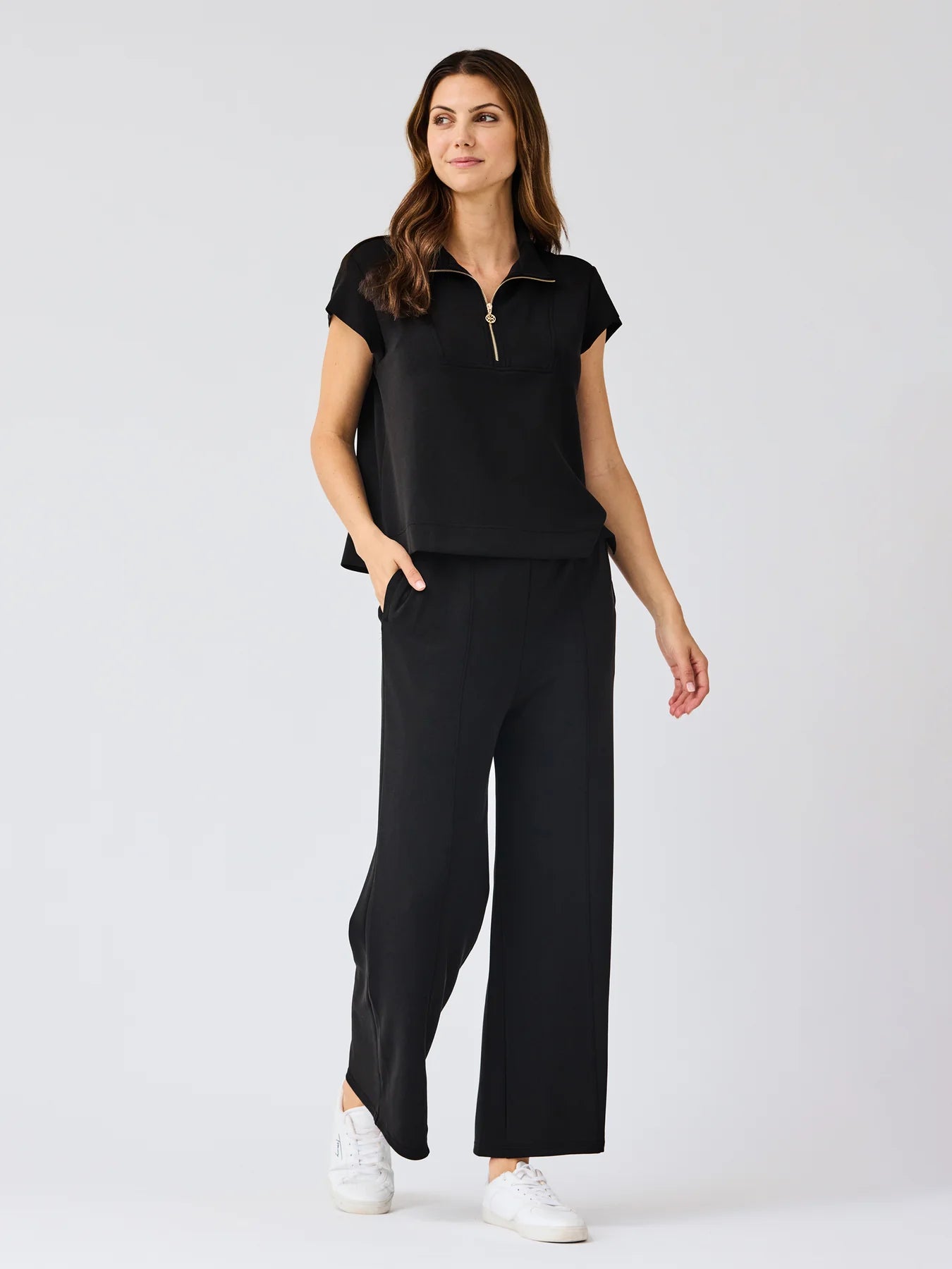 Black Stephie Top: ultra-soft modal blend, short-sleeve, zip-up. Available in XS-XL.