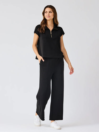 Black Stephie Top: ultra-soft modal blend, short-sleeve, zip-up. Available in XS-XL.
