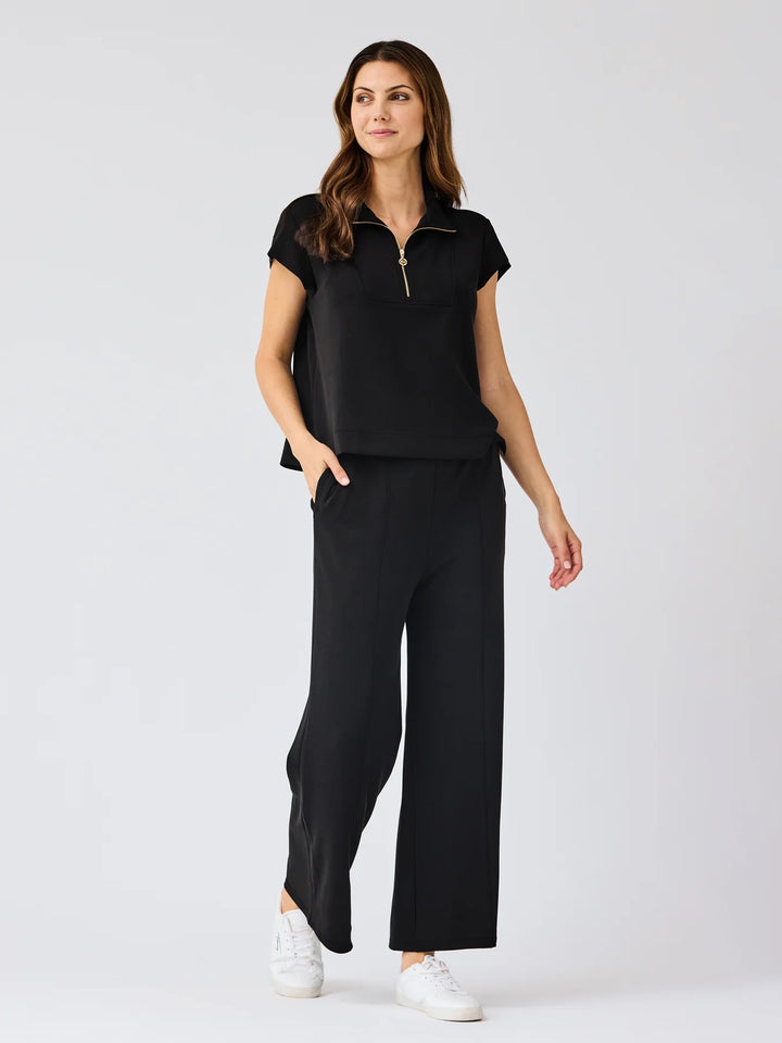 Black Stephie Top: ultra-soft modal blend, short-sleeve, zip-up. Available in XS-XL.