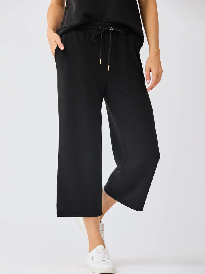 Sabrina Cropped Pants in black with elastic drawstring waistband. Available in sizes XS–XL.