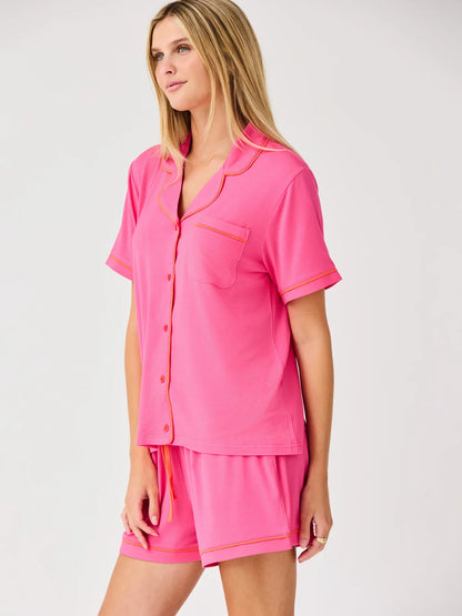 Charlotte Pink Shorts Set: bright pink luxury pajama with orange piping, chest pocket, relaxed-fit modal shorts. Sizes XS-XL.