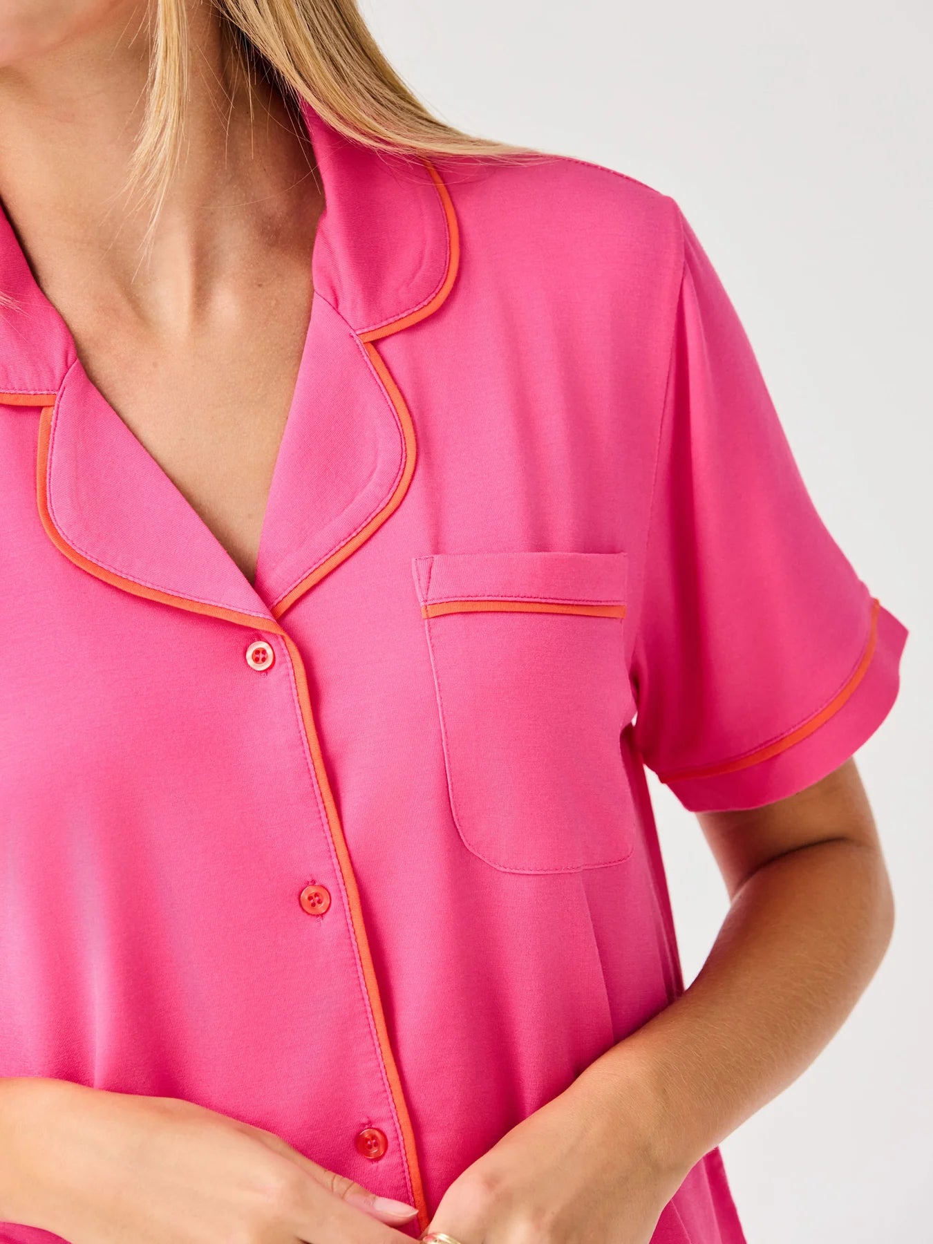 Charlotte Pink Shorts Set: bright pink, orange piping, chest pocket, front buttons. Available in sizes XS-XL.