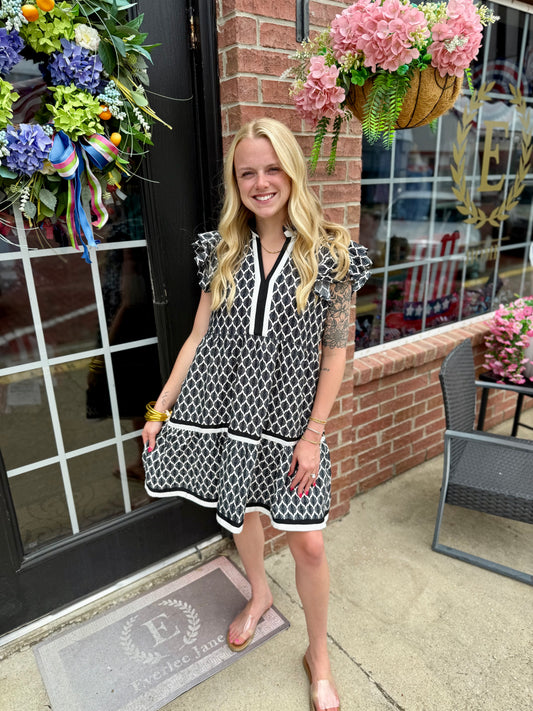 Black Ruffle Baroque Pattern Tiered Dress, available in sizes XS-XL. Features ruffle accents and a tiered silhouette.