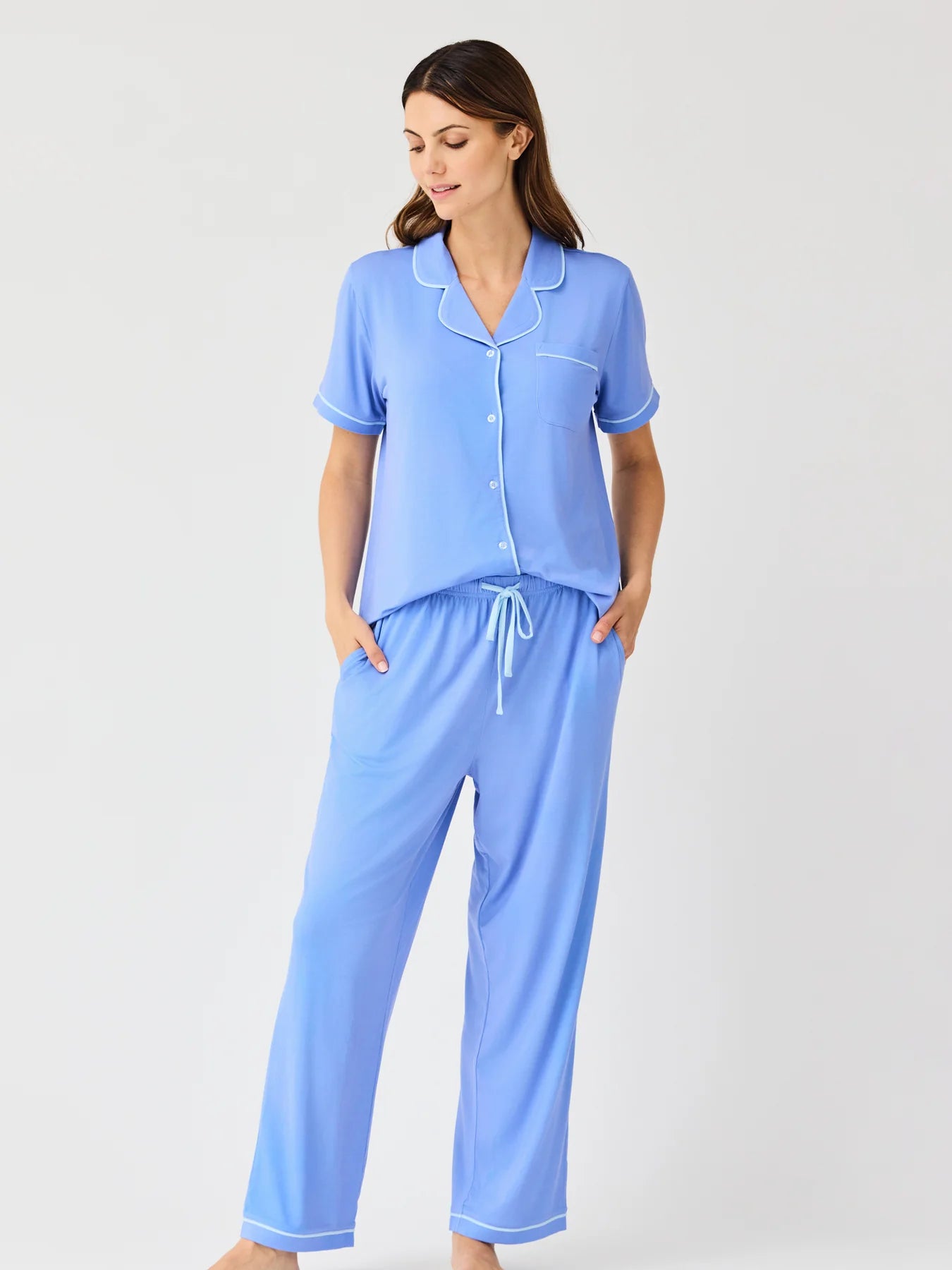 Charlotte Blue Pants Set: light blue women’s pajamas with white trim, short-sleeve button top, chest pocket, drawstring pants. Sizes S–XL.