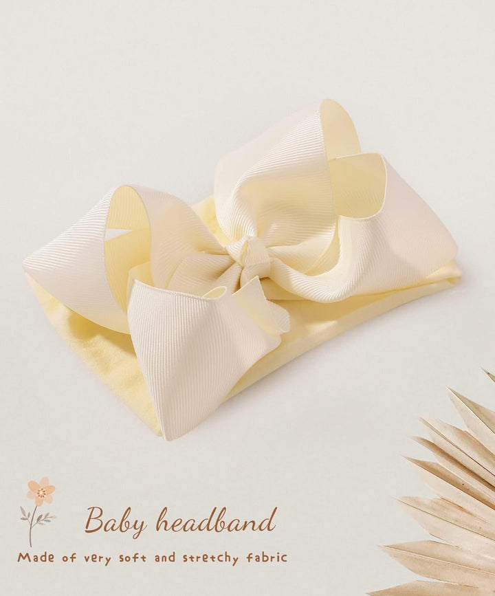 Pale yellow bow headband for infants &amp; toddlers with large textured bow, soft stretchy fabric. Available in multiple sizes.