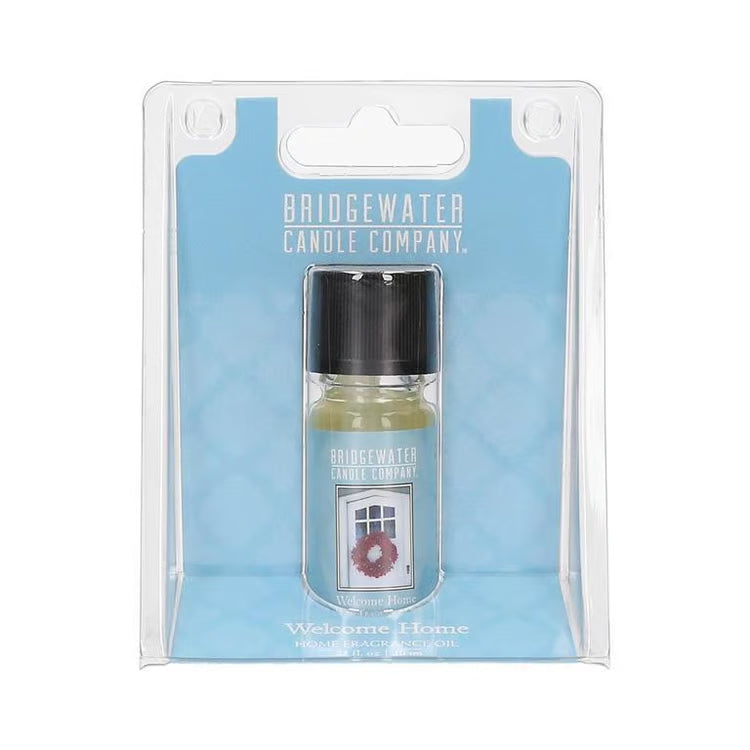 Welcome Home Fragrance Oil in a small bottle and clear plastic retail packaging.