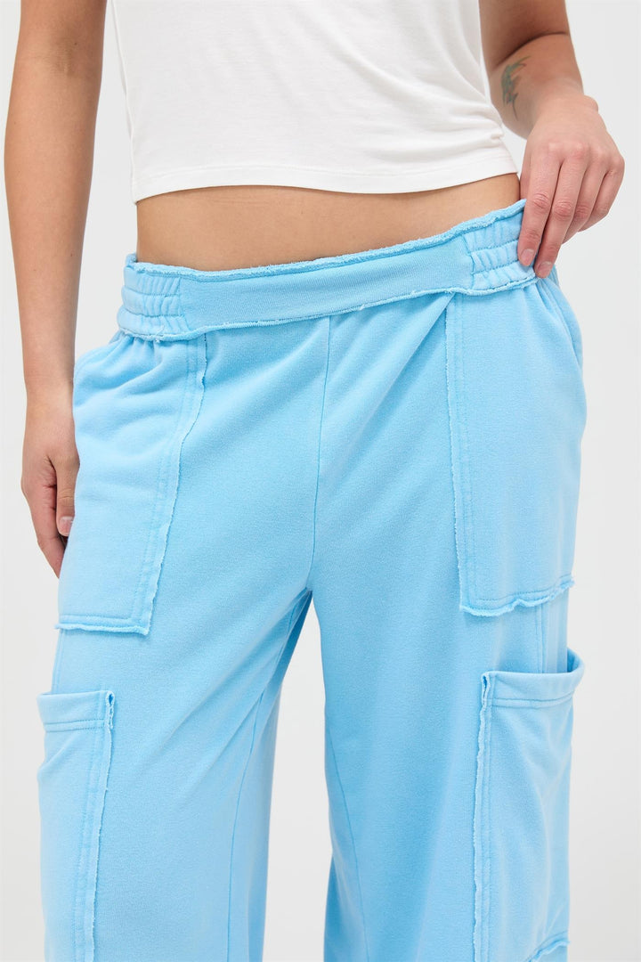Light blue Mineral Wash Wide Leg Cargo Pants with high rise, wide legs, large patch pockets. Available in sizes XS–XL.
