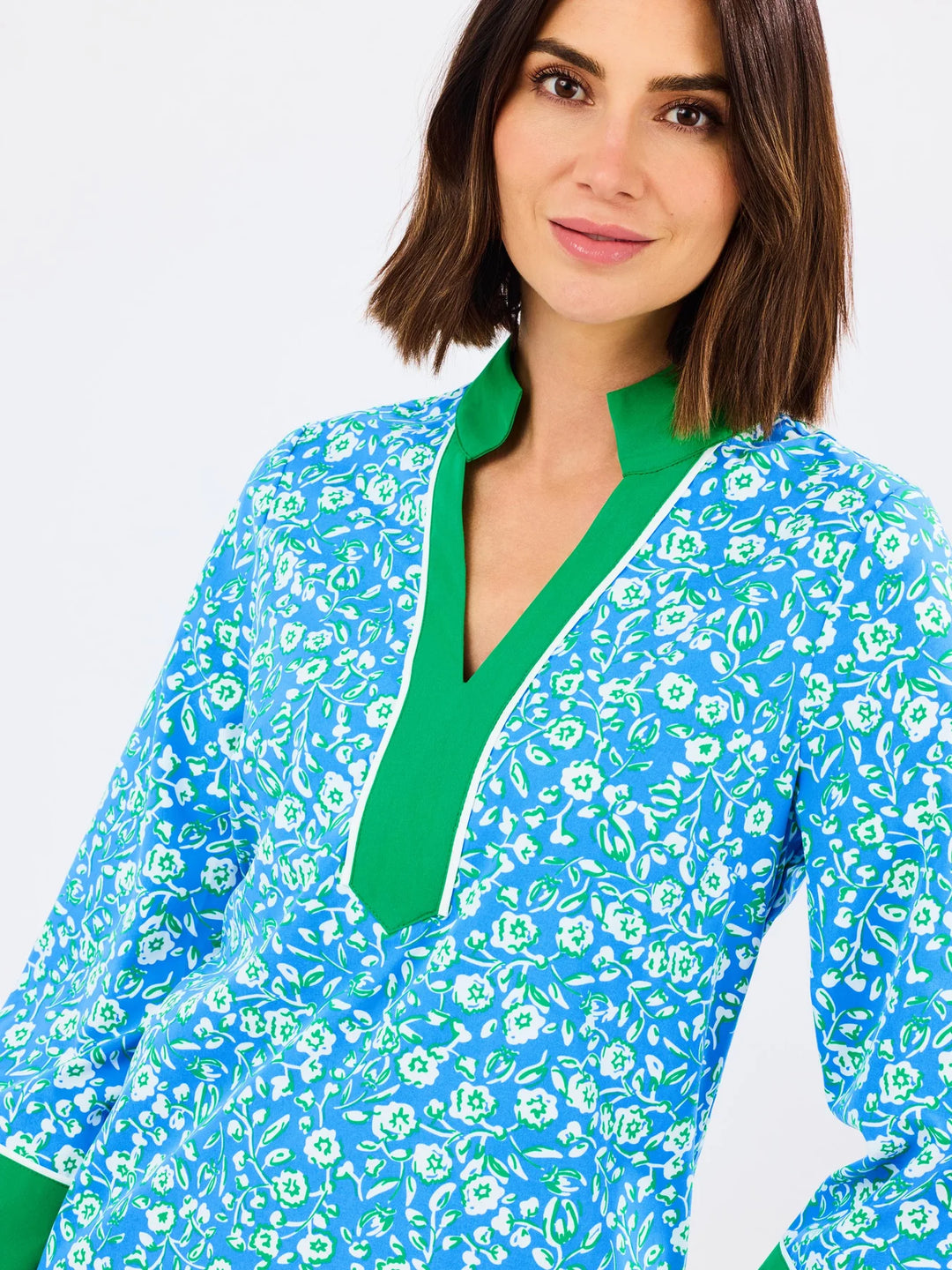 Brenda Meadow Line Blue Dress: blue floral pattern, collared V-neck with bright green trim. Available in sizes XS–XL.