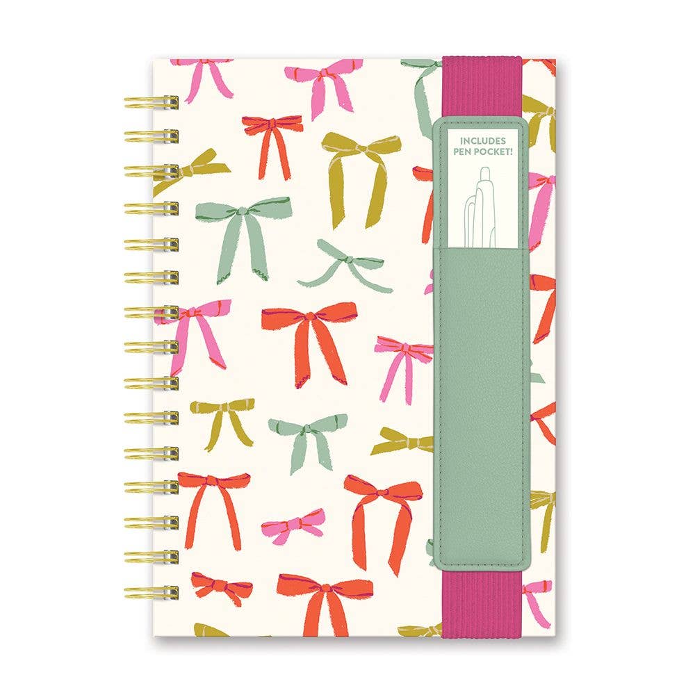 Notebook with colorful bow cover, mint green vegan leather pen pocket, wide pink elastic band. Sizes: small, medium, large.