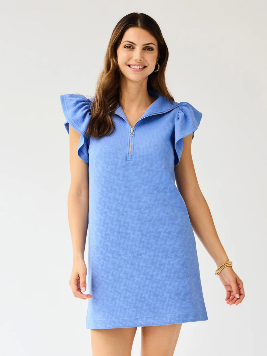 Paige Blue Dress with flutter sleeves, ruffled shoulders, and gold metal zipper. Available in sizes XS–XL.