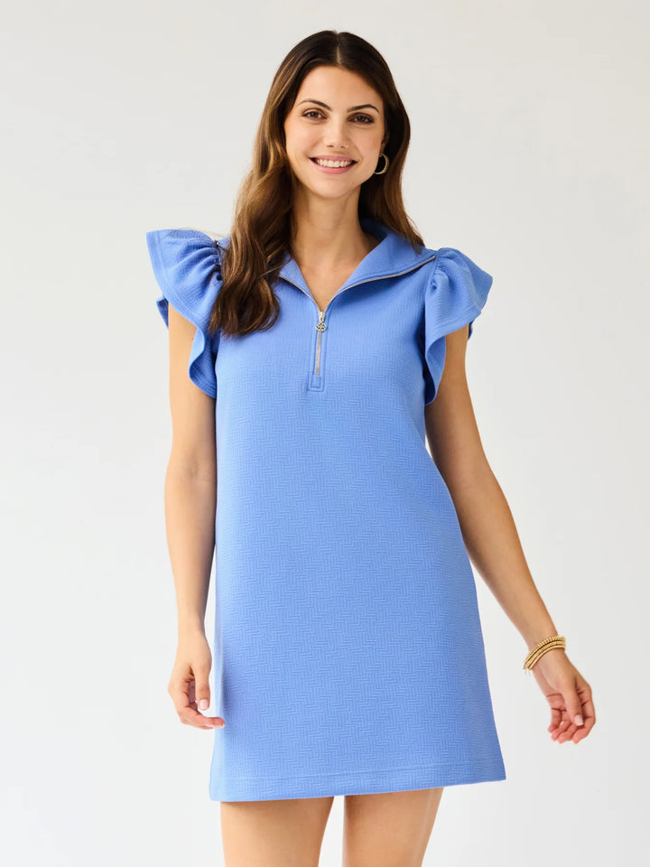 Paige Blue Dress with flutter sleeves, ruffled shoulders, and gold metal zipper. Available in sizes XS–XL.