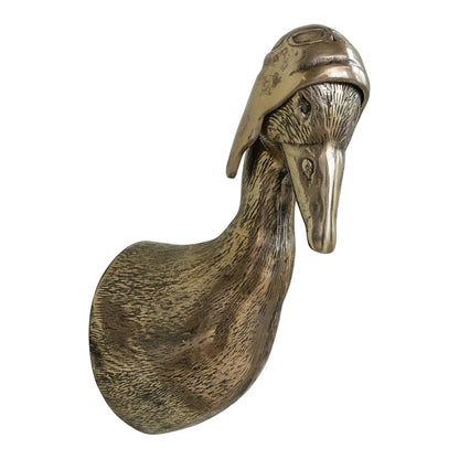 Cast aluminum duck head sculpture with aviator helmet, antique brass finish, detailed feathers. Available in two sizes.