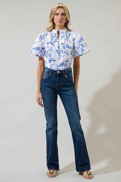 Leya Floral Inaya Split Neck Top featuring a floral print and split neckline. Available in sizes XS-XL.