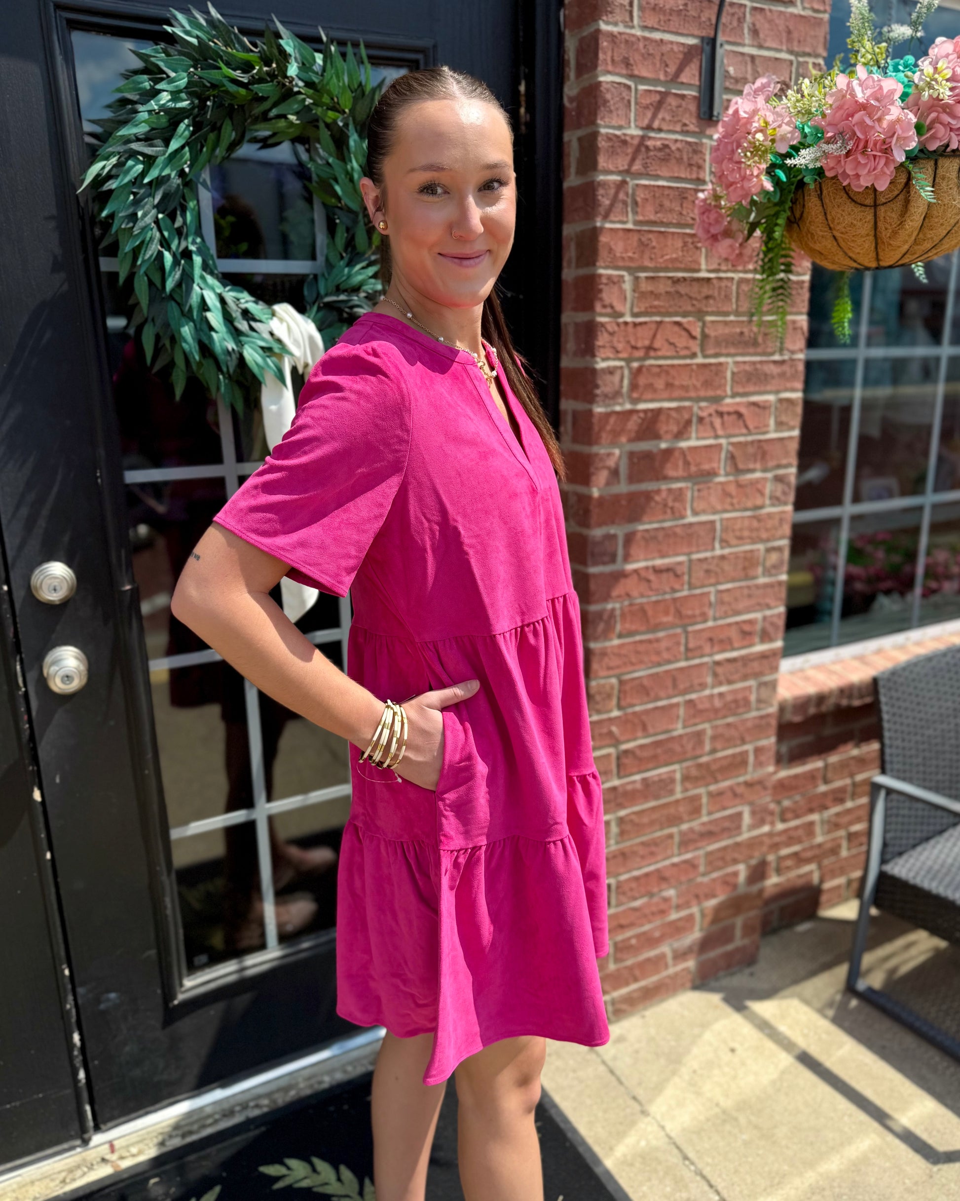The Adelyn Pink Dress features a feminine style and is available in sizes XS–XL.