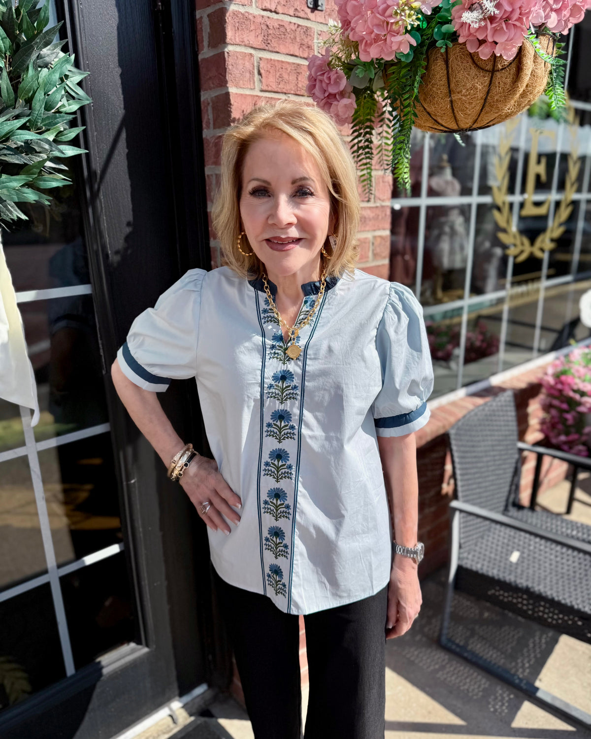 Bluebell Embroidered Blouse with delicate floral embroidery and subtle puff sleeves. Available in sizes XS–XL.