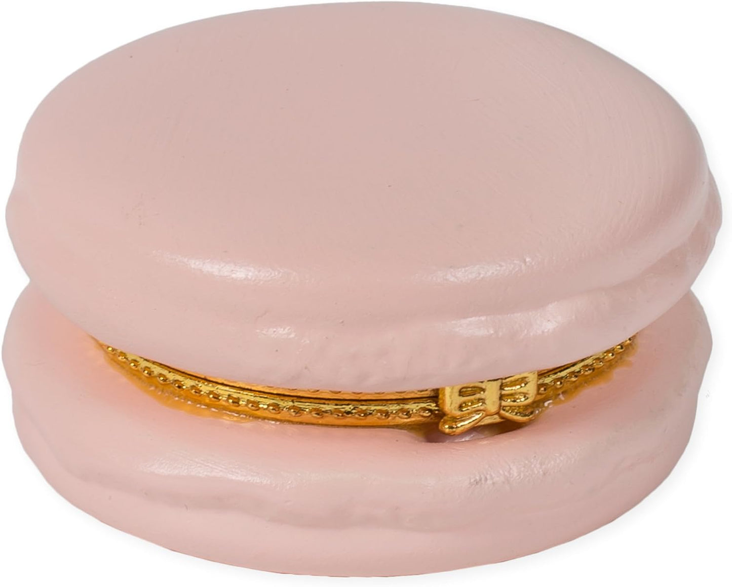 A small, pink ceramic Macaron Limoge trinket box shaped like a sweet macaron. Features a gleaming metallic gold zipper detail on its side. Perfect to store tiny keepsakes or jewelry items. Size availability is not listed for this product.