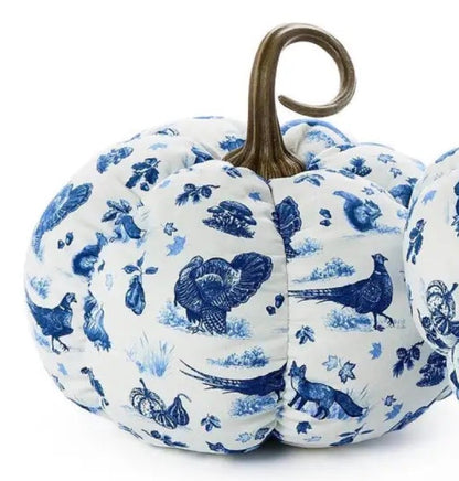 White pumpkins with blue toile designs of birds, foxes, and foliage, finished with a brown curly stem. Available in multiple sizes.
