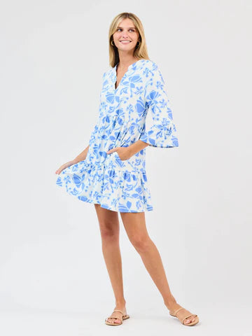 Laguna Blossom Breeze Dress: light blue/white floral, long-sleeve, short ruffled dress. Sizes: XS-XL.