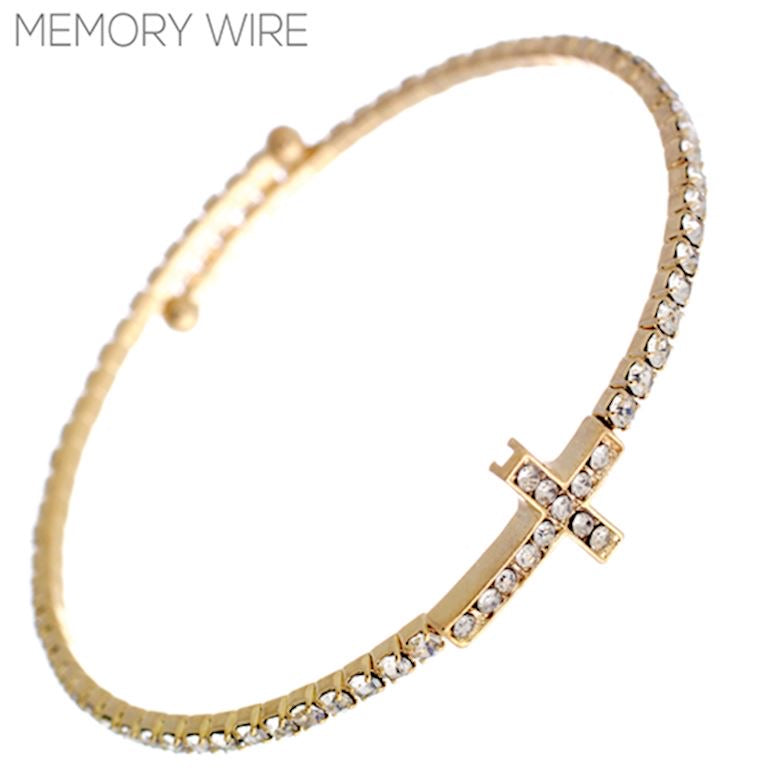 Thin gold bracelet with clear rhinestones and a rhinestone cross charm. Available in S, M, and L sizes.