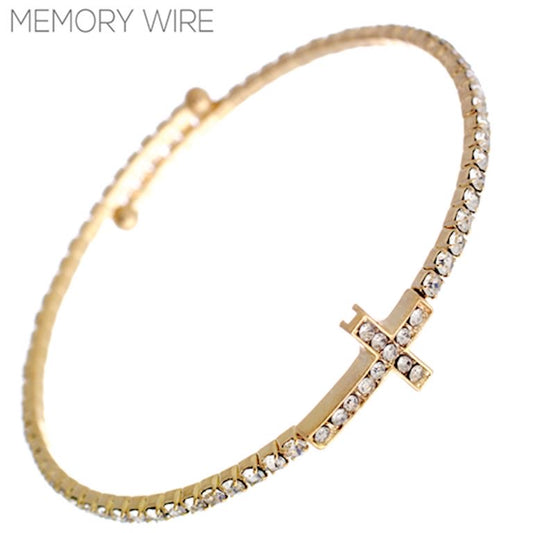 Thin gold bracelet with clear rhinestones and a rhinestone cross charm. Available in S, M, and L sizes.