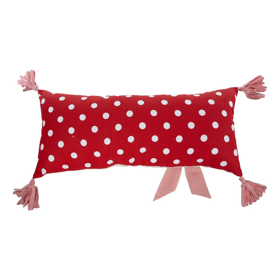 Red rectangular Joyful Pillow with white polka dots, striped corner tassels, and a striped ribbon.