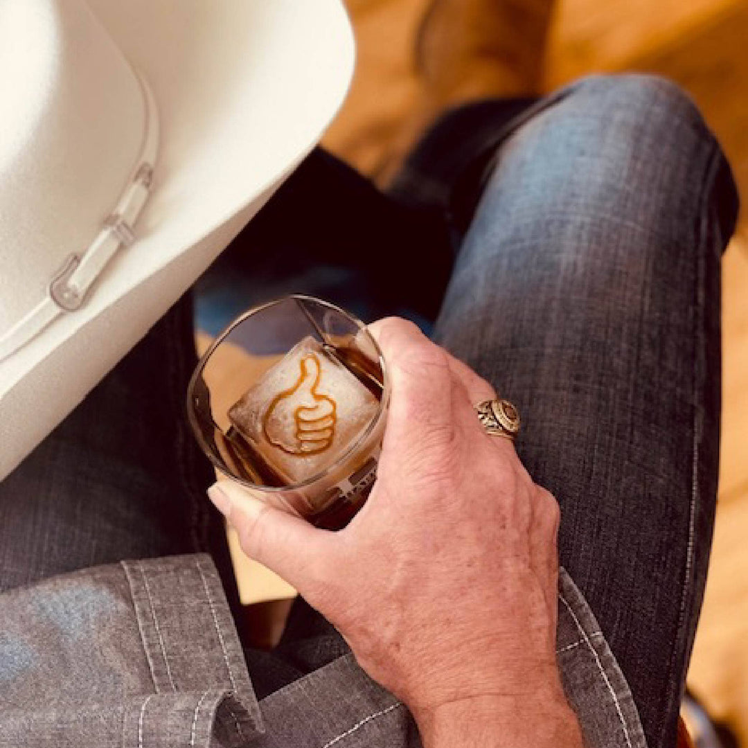 Texas A&amp;M Thumb Inserts—3 Pack, available in multiple sizes, shown inside a glass of brown liquor.