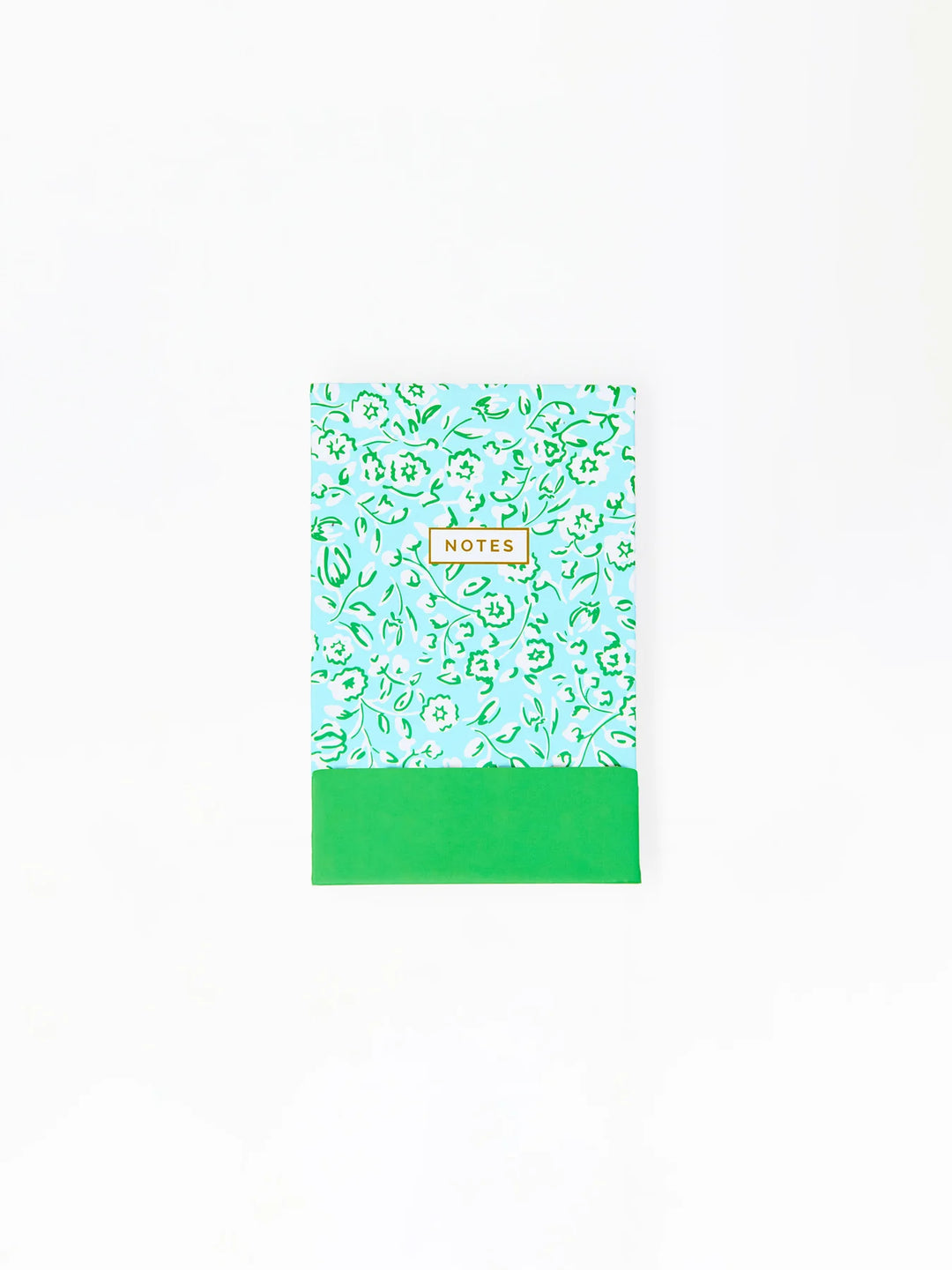 Compact notepad with light blue and green floral cover, "NOTES" in yellow-bordered box, solid green bottom. Sizes available.