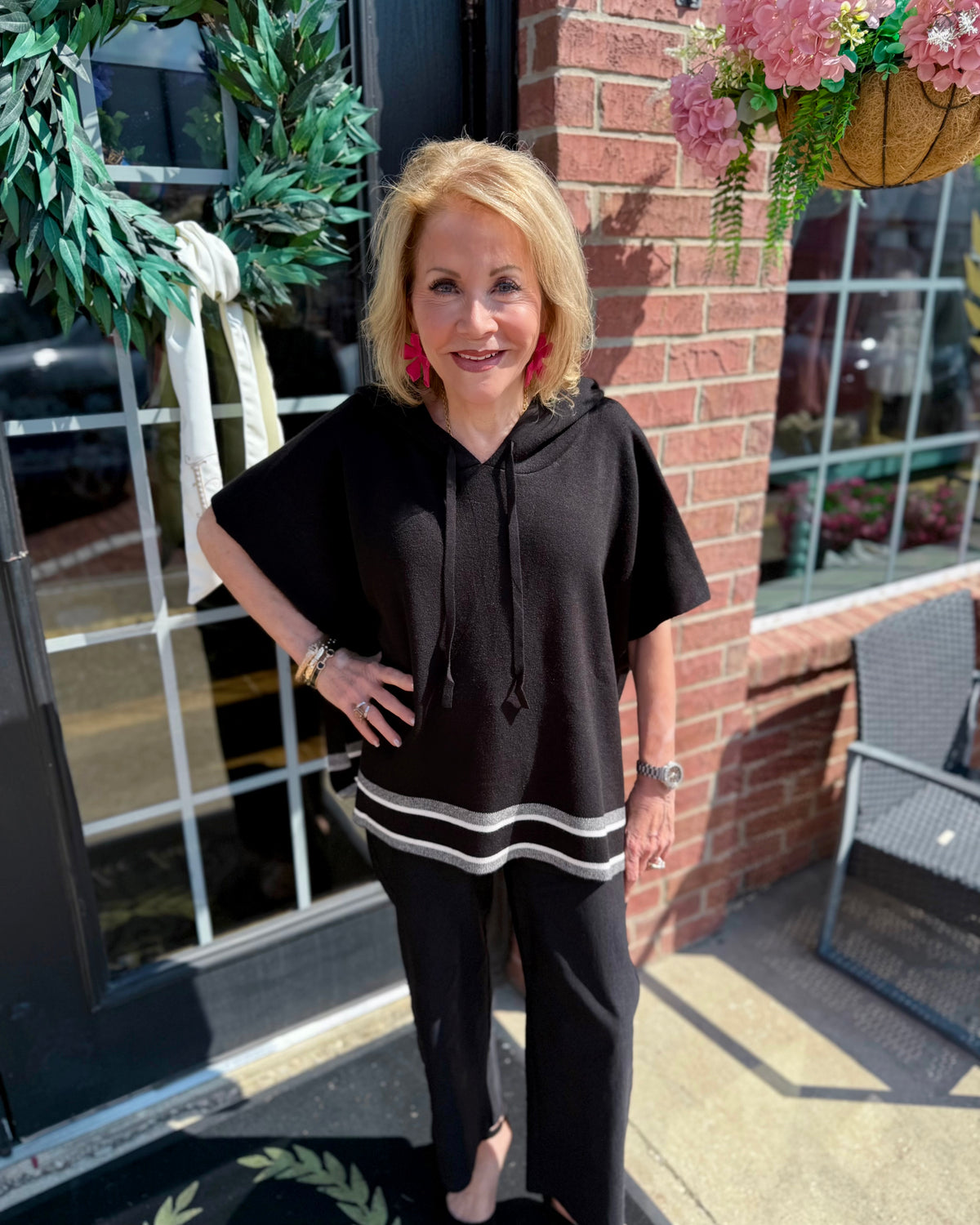 Aspen Stripe Hoodie Poncho: black with white stripes, hooded, cozy layering piece. Available in sizes XS–XL.