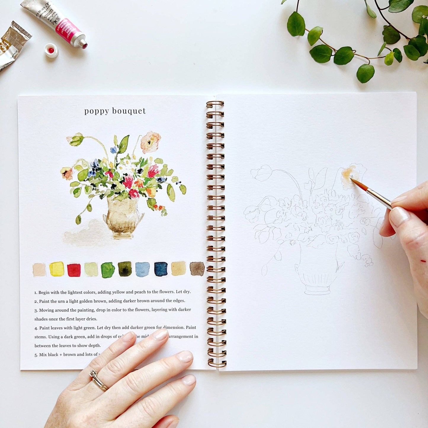 The Bouquets Watercolor Workbook, open to a poppy painting and sketch. Available in 8x10 and 9x12 inch sizes.
