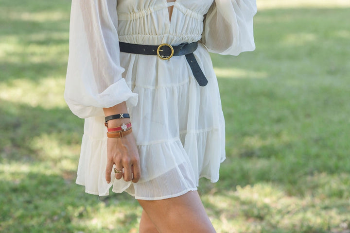 Brass-Toned Circle Buckle Leather Belt: Crafted from genuine leather with a distinctive brass-toned circle buckle. Sizes available: S, M, L, XL.