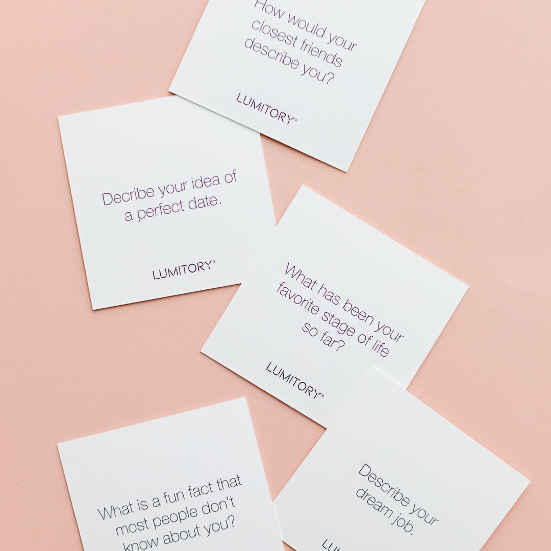 Set of five white "Conversation Cards Girls Night" with unique questions and LUMITORY logo. Available in standard size.