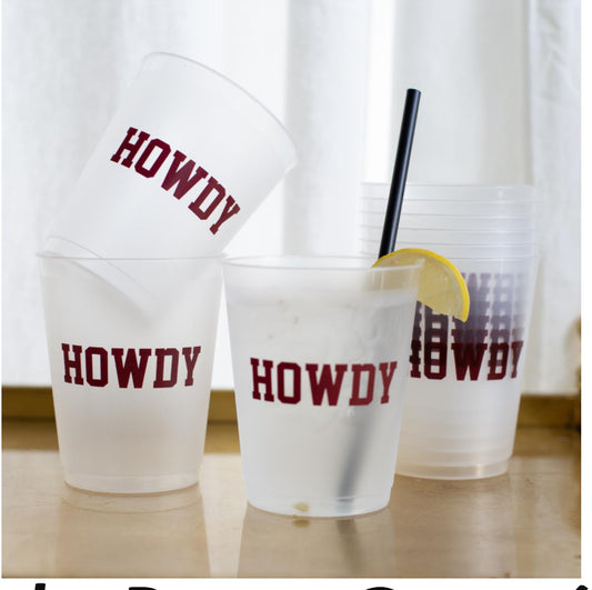 The Howdy Frosted Party Cups, set of 10 transparent plastic cups holding up to 16oz, feature "HOWDY" in bold red letters.