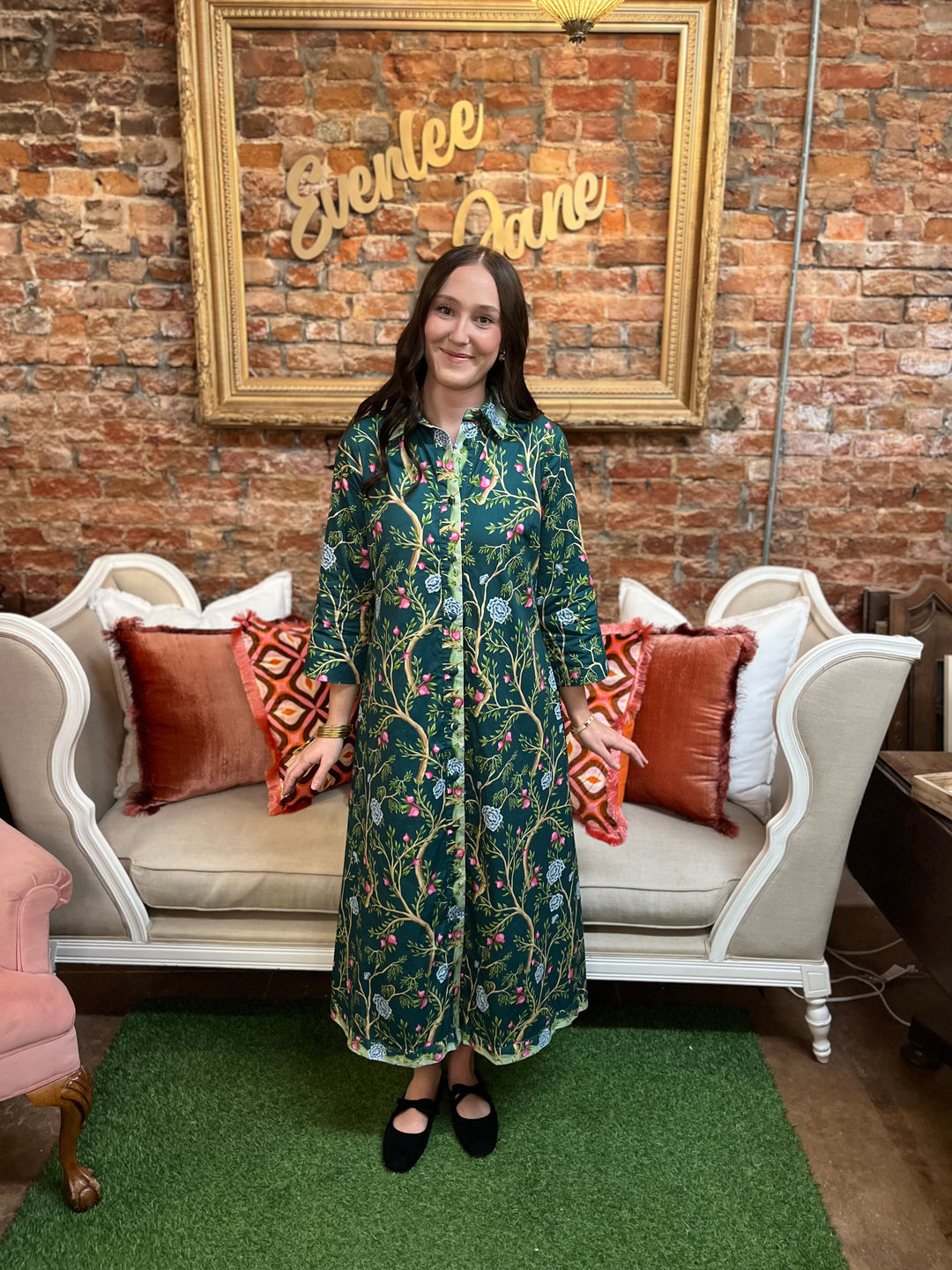 Green botanical print midi dress with collar, long sleeves, button front, and contrast trim. Available in multiple sizes.