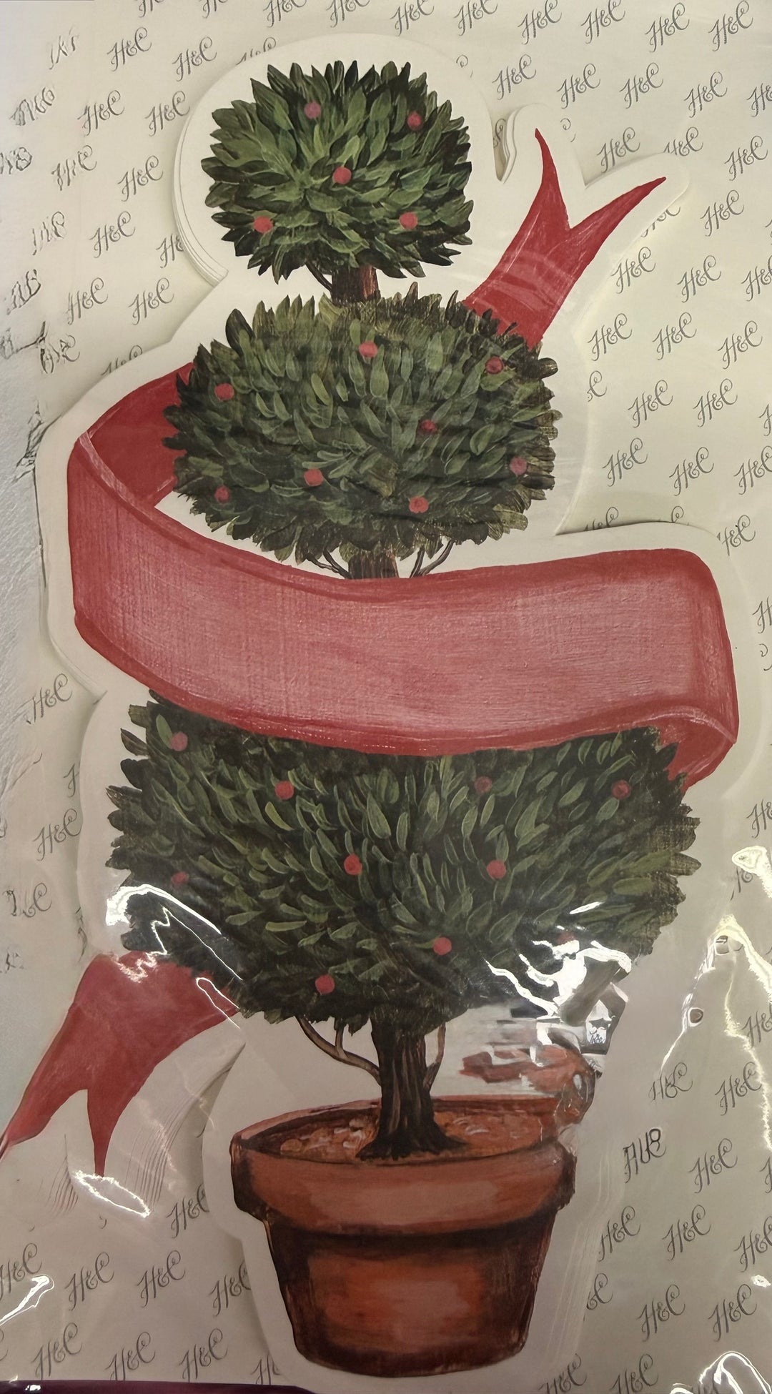 Holiday Topiary Table Accent KP873EF, a three-tiered topiary tree in a terracotta pot with a red ribbon.