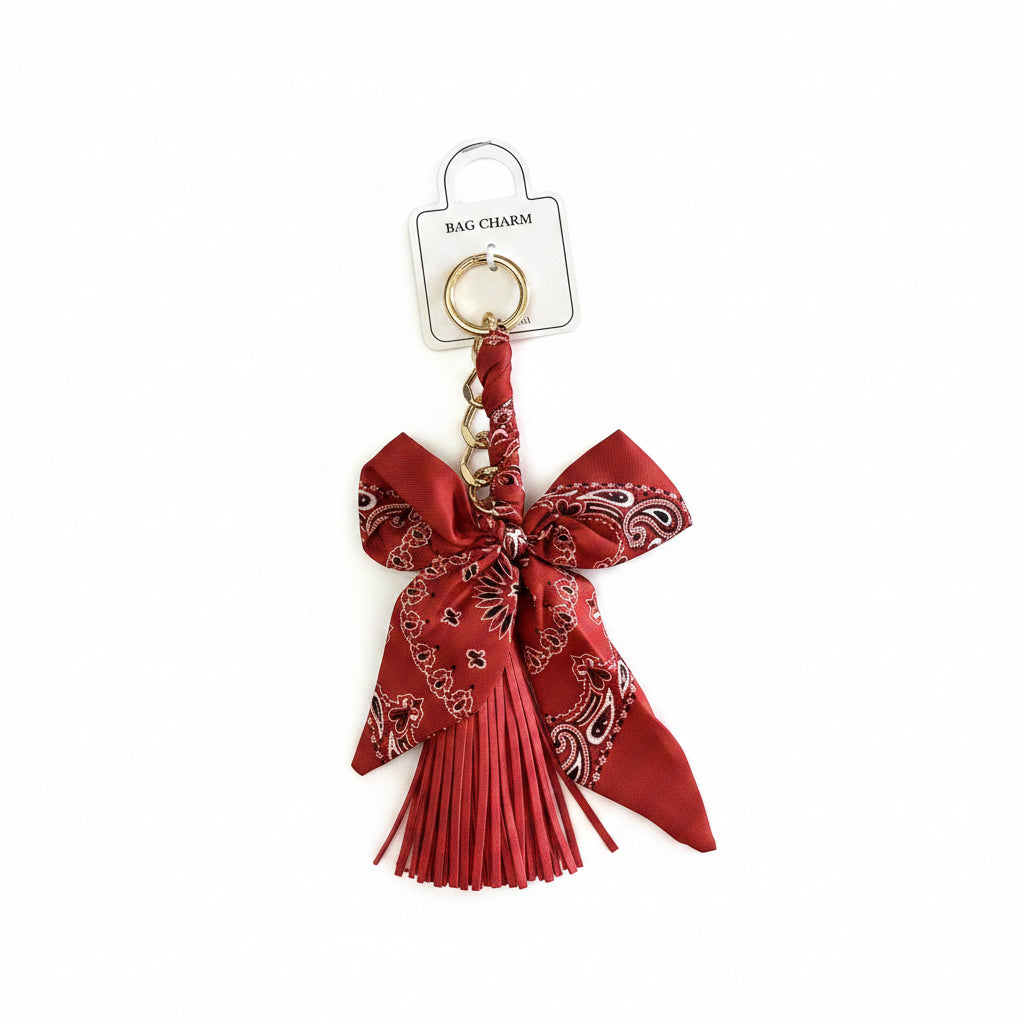 Red paisley bow tassel bag charm with gold keyring. Available in small, medium, and large sizes.