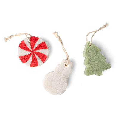 Lemon Lavender Bubbly and Bright Super Sudsy Soap Sponge set includes three exfoliating sponge ornaments: a red and white peppermint candy, a white snowman, and a green Christmas tree, each with a hanging string. Available in one size.