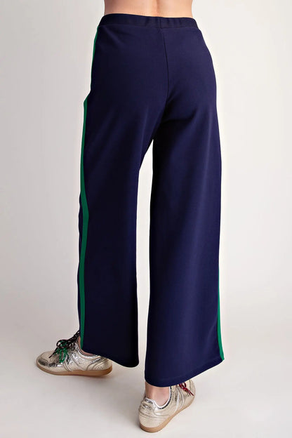 Everyday Pull-on Contrast Pants in navy blue with green side stripes, available in sizes XS-XL.