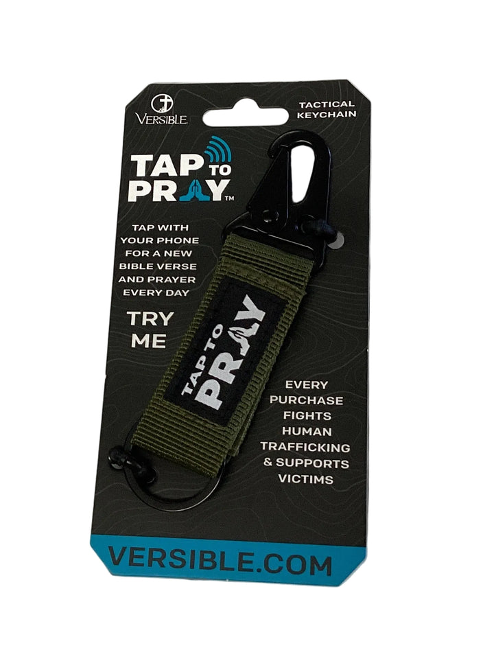 Olive green Tap To Pray keychain with black carabiner; includes packaging for daily Bible verse feature.