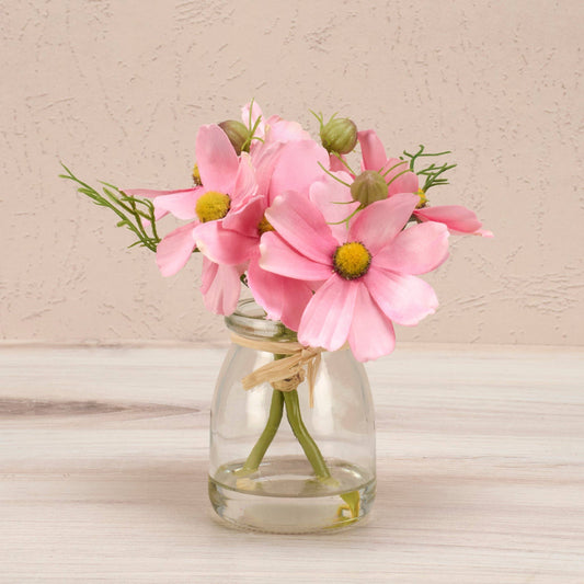 Pink Cosmos Vase in glass with twine bow, holds daisy-like flowers and green buds. Available in small, medium, and large sizes.