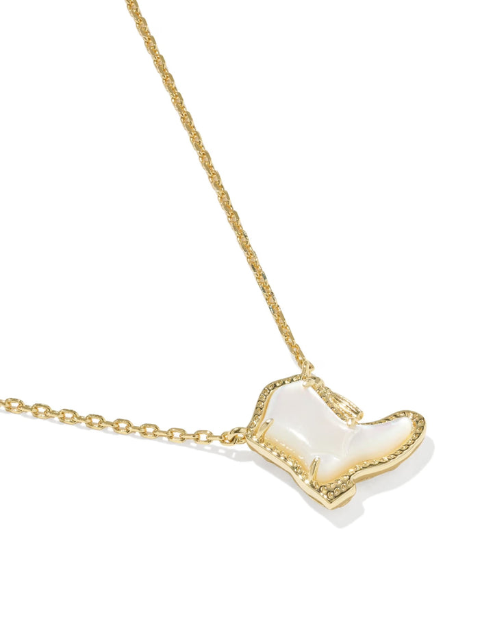 Drill Team Boot Necklace by Kendra Scott features a gold-finished cowboy boot pendant with a white shiny interior and gold trim. Available in multiple lengths.