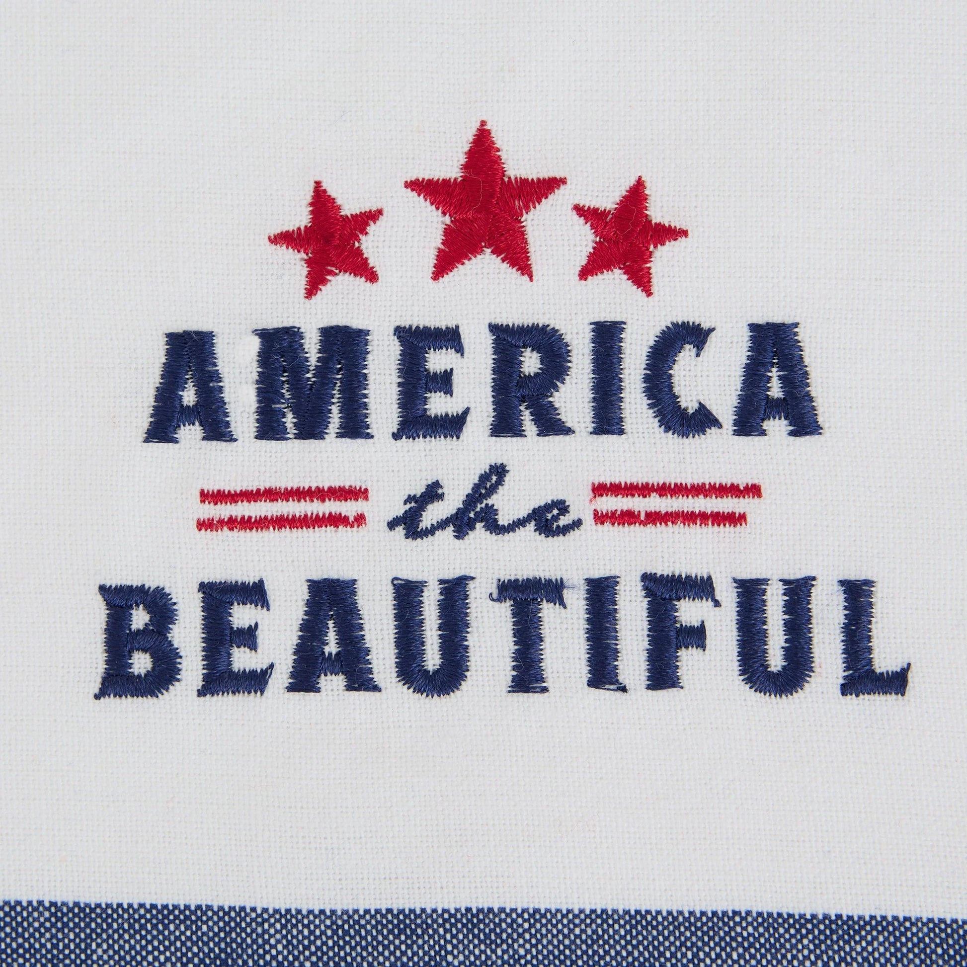 White dish towel with "AMERICA the BEAUTIFUL" in blue, three red stars, two red lines, blue striped border. Sizes available.