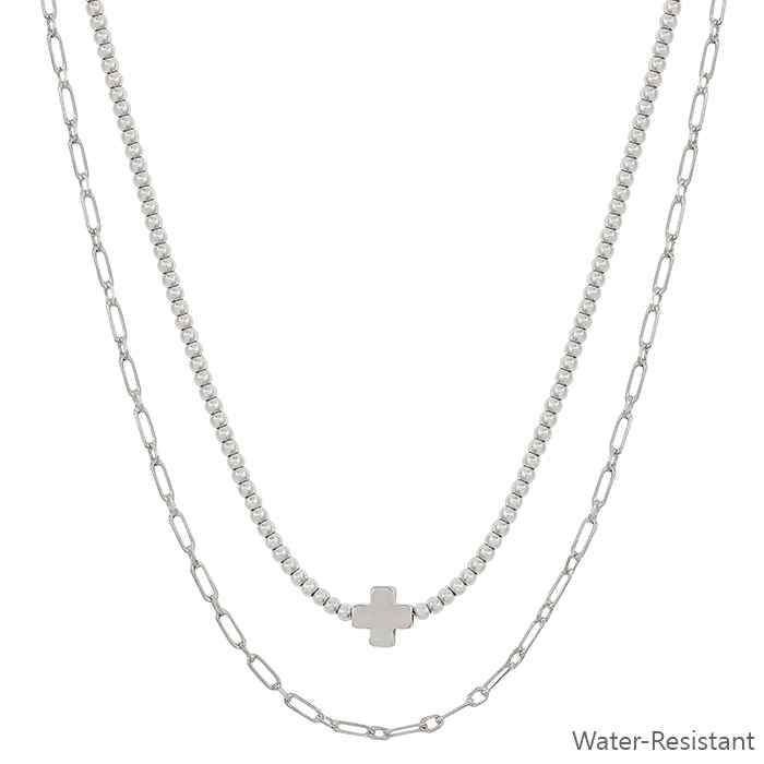 Beaded layered necklace with gold cross and oval links; "Water-Resistant" text shown. Available sizes: S, M, L.