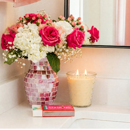 Sweet Grace Collection Candle #80, lit on counter. Available sizes: 8oz, 20oz, 32oz. Mosaic vase not included.