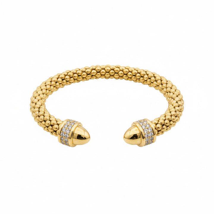 Gold cuff bracelet with textured, beaded design, CZ-studded rounded ends. Available in sizes S, M, and L.