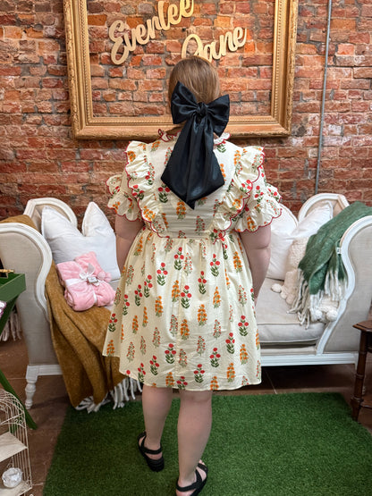 Butter Meadow Dress: light floral ruffle dress. Available in sizes XS–XL.