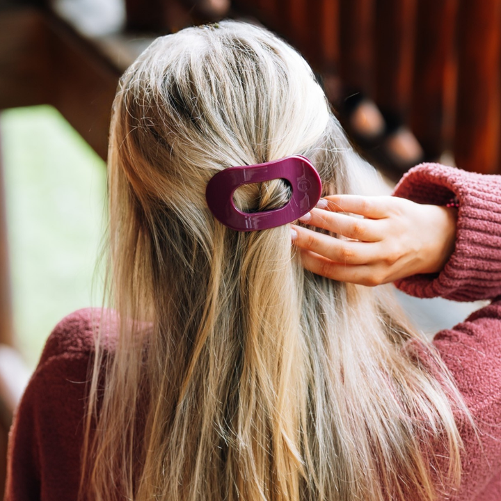 Mulberry Small Flat Round Hair Clip shown in use; available in small size.