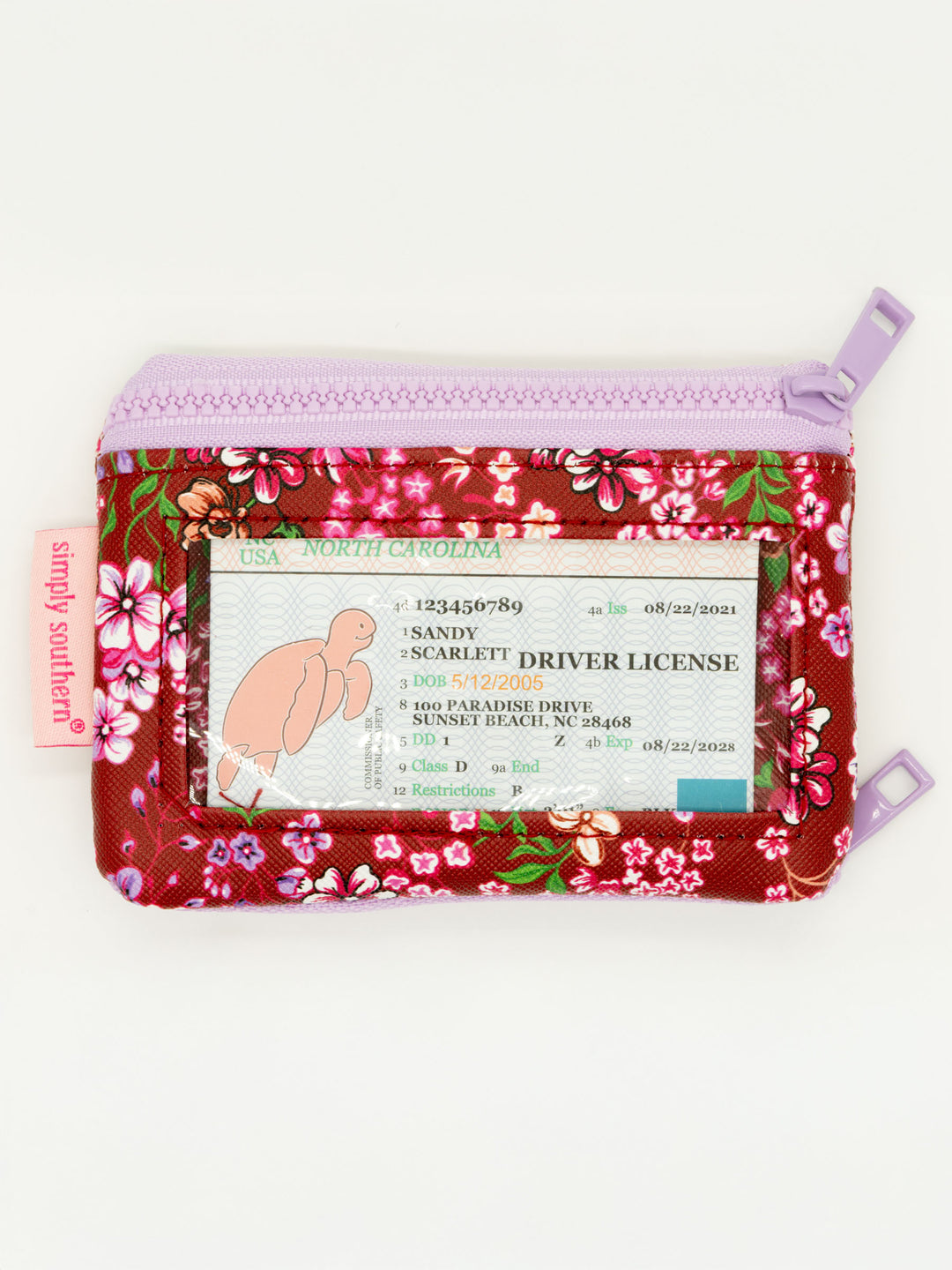 Small red and pink floral ID wallet with clear window, lavender zipper, pink "simply southern" tag. Sizes available: one size.