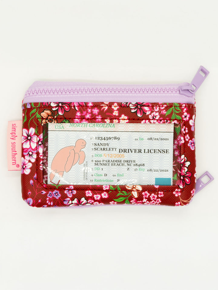 Small red and pink floral ID wallet with clear window, lavender zipper, pink "simply southern" tag. Sizes available: one size.