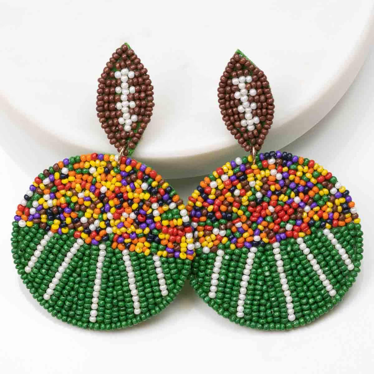 Football Field Beaded Earrings: round, multicolored beads, brown and white leaf-shaped top. Sizes available: small, medium.