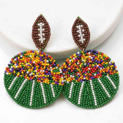 Football Field Beaded Earrings: round, multicolored beads, brown and white leaf-shaped top. Sizes available: small, medium.